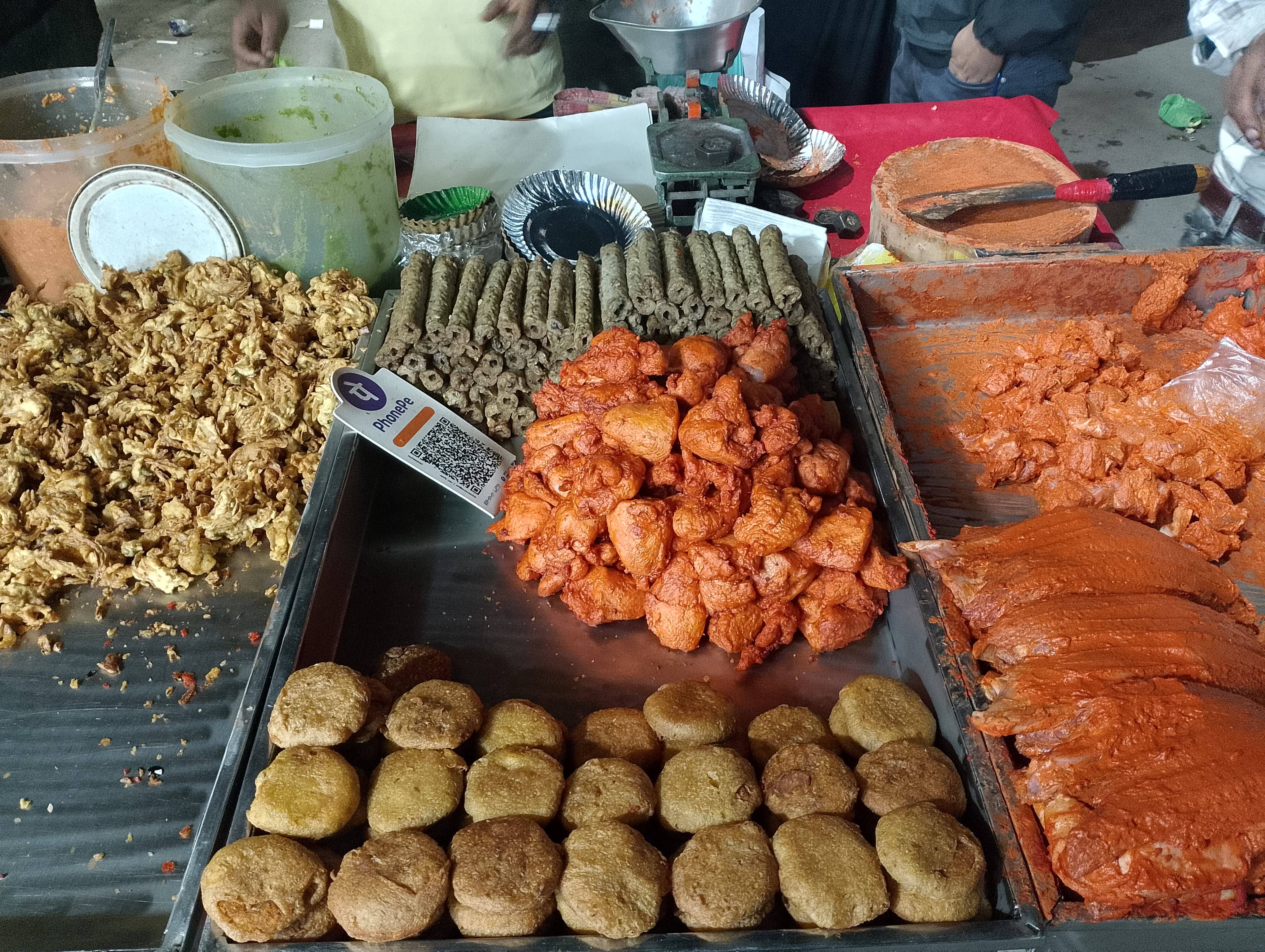 An assortment of marinated meat kebabs displayed openly. When it comes to hygiene, noone can compete with Indians!